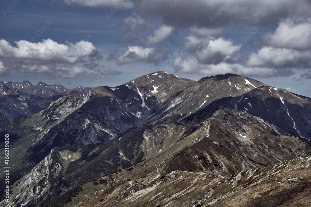 Rocky peaks and clouded sky in the Tatra Mountains in Poland.