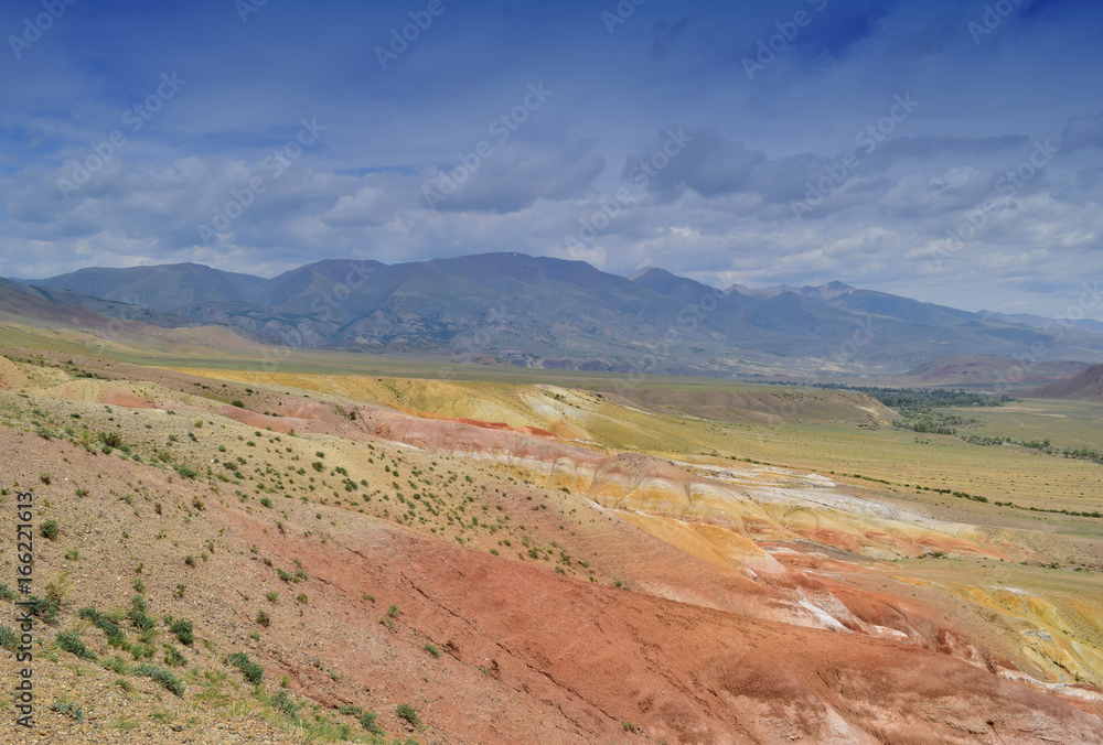 View of red and yellow hills. Landscape of steppe and colorful Altai mountains. Altay Republic, Russia.