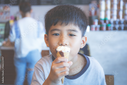 Asian boy eating ice cream.