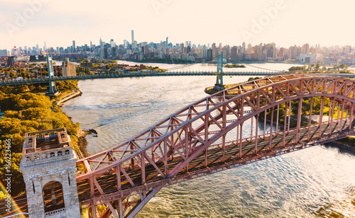 Aerial view of the Hell Gate Bridge over the East River in New York City photo