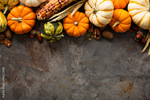Fall copy space with pumpkins and corn photo