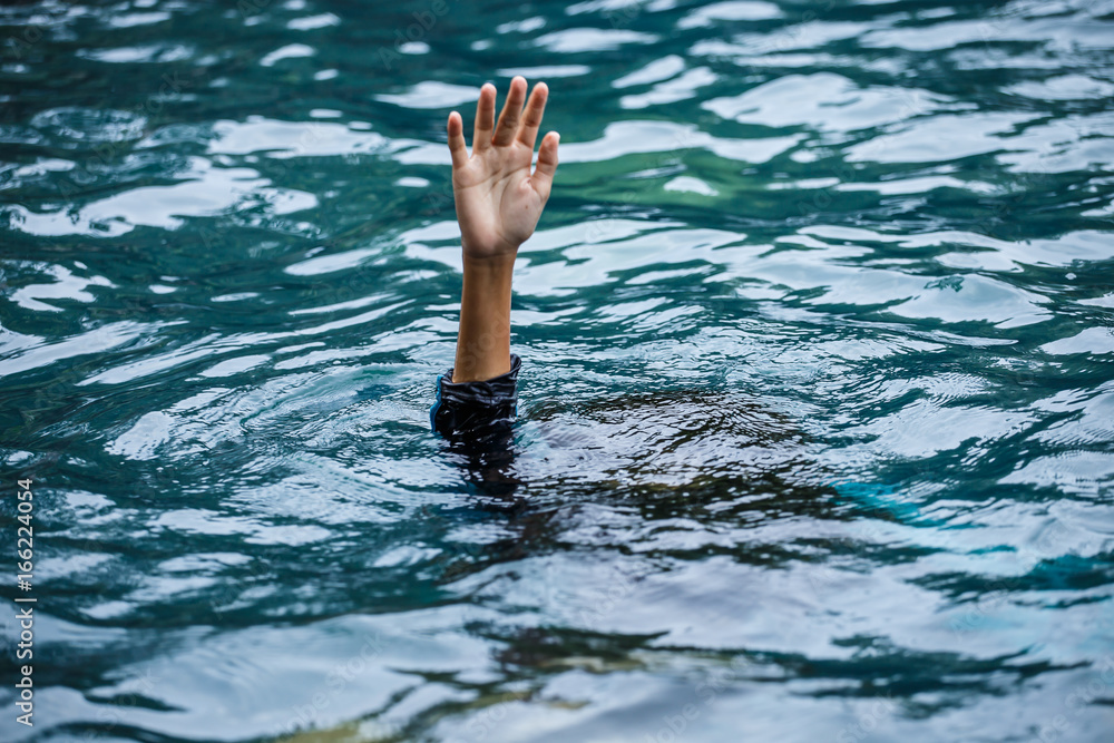 Drowning people raise hands for help in the pool.
