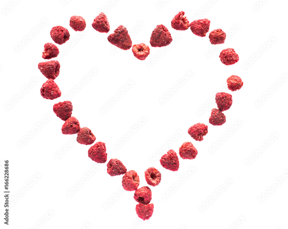 Freeze dried raspberries on a white background in the form of heart. Lyophilization. Food for astronauts. Freeze dried raspberries on a white background in the form of heart. Lyophilization. Food for astronauts.