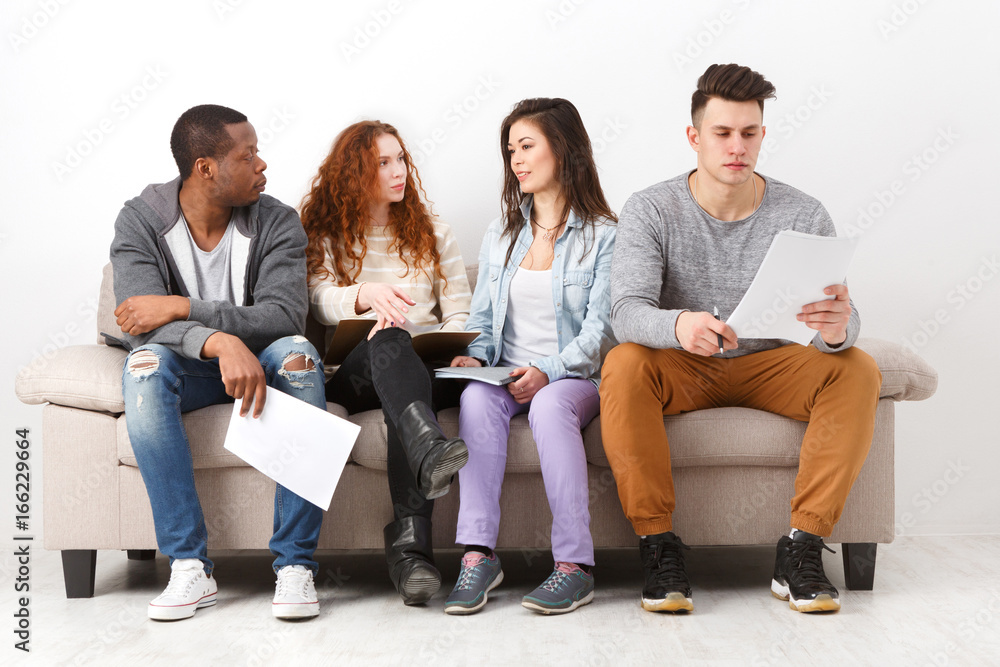Diverse young students preparing for exam at home Diverse young students preparing for exam at home