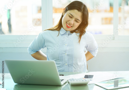 close up employee woman stretching her back after hard working,office syndrome unhealthy lifestyle concept Free Download close up employee woman stretching her back after hard working,office syndrome unhealthy lifestyle concept - GFXLoad