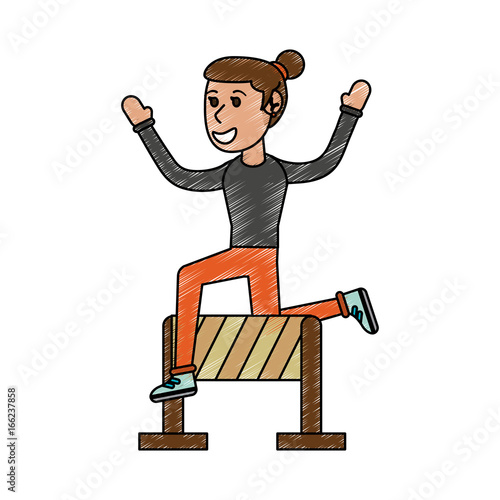 girl jumping over hurdle
