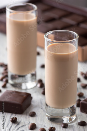 Liqueur with chocolate sweets and coffee beans