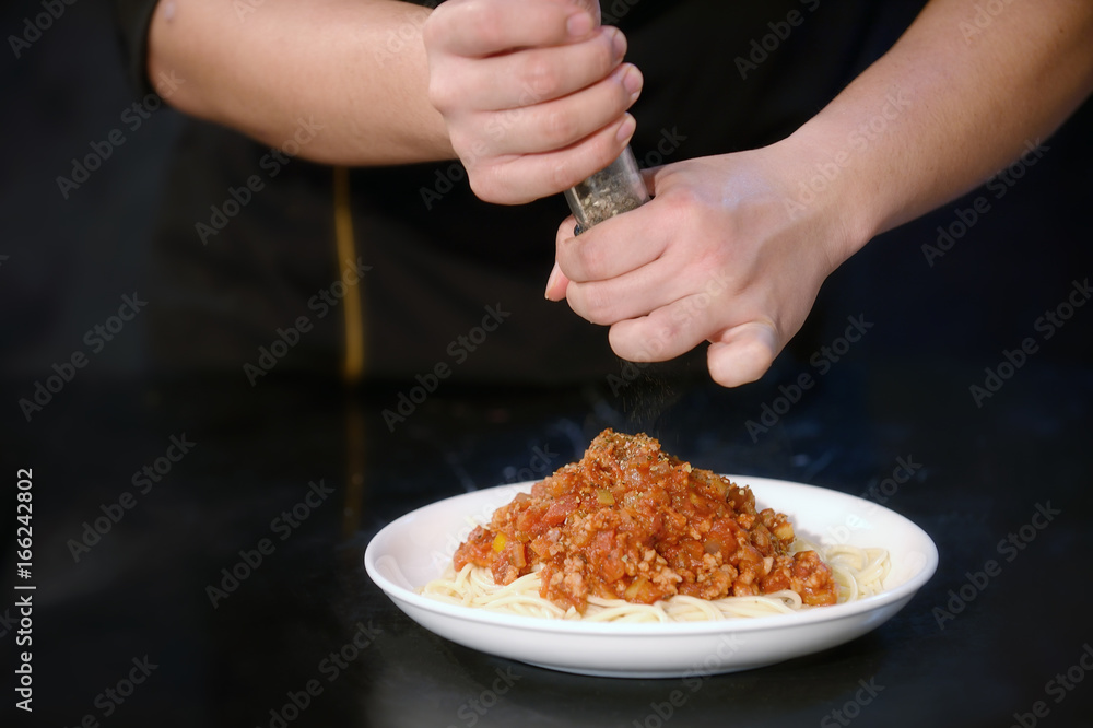 Closeup hand chef cooking spaghetti in kitchen luxury