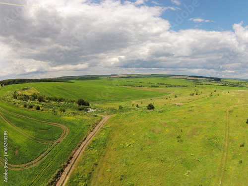 Aerial view of the sown fields with road photo