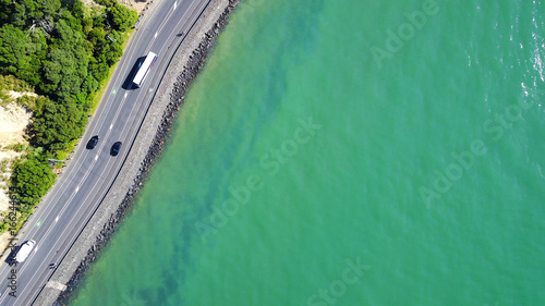 Aerial view on a road running along sea shore. Auckland  New Zealand.