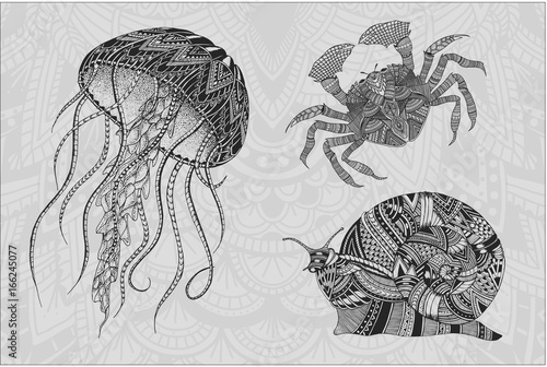 Patterned jellyfish, crab and snail. Tattoo design. It may be used for design of a t-shirt, bag, postcard, a poster and so on.
