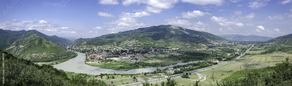 Mtskheta near Tbilisi in Georgia - Caucasus. Panorama view on river and unesco town Mtskheta from Jvari church near Tbilisi in Georgia.