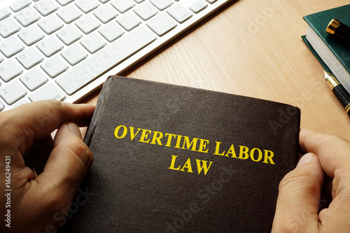 Book with title overtime labor law. photo
