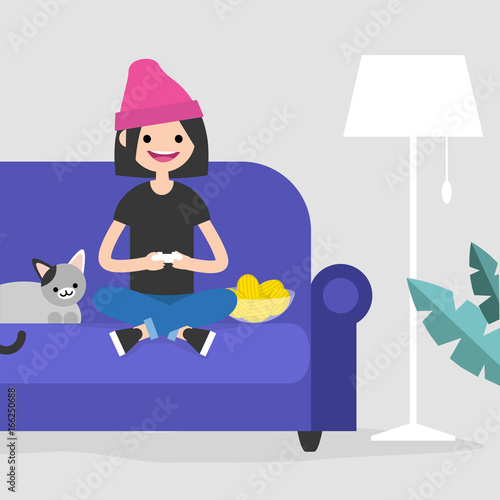 Young excited female character playing video games / flat editable vector illustration, clip art