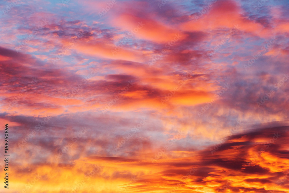 colorful sky at sunset with altocumulus, altostratus and cirrus clouds
