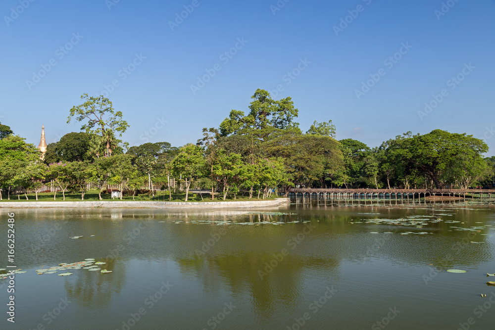 View of the Kandawgyi Lake and park in Yangon, Myanmar in the daytime.
