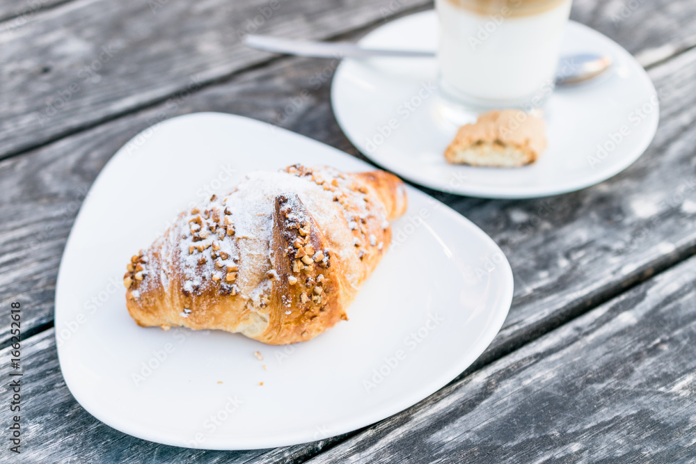 coffee cup latte and fresh baked croissants on wooden background with copy space coffee cup latte and fresh baked croissants on wooden background with copy space