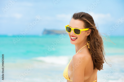 People summer fun. Happy young beautiful woman on the beach.  © kieferpix