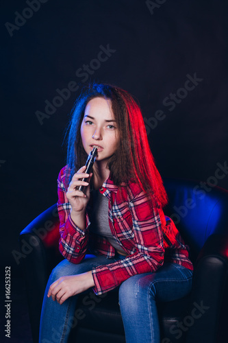  Woman smoking electronic cigarette with smoke