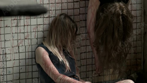 Bloody girls are unconscious in the old building