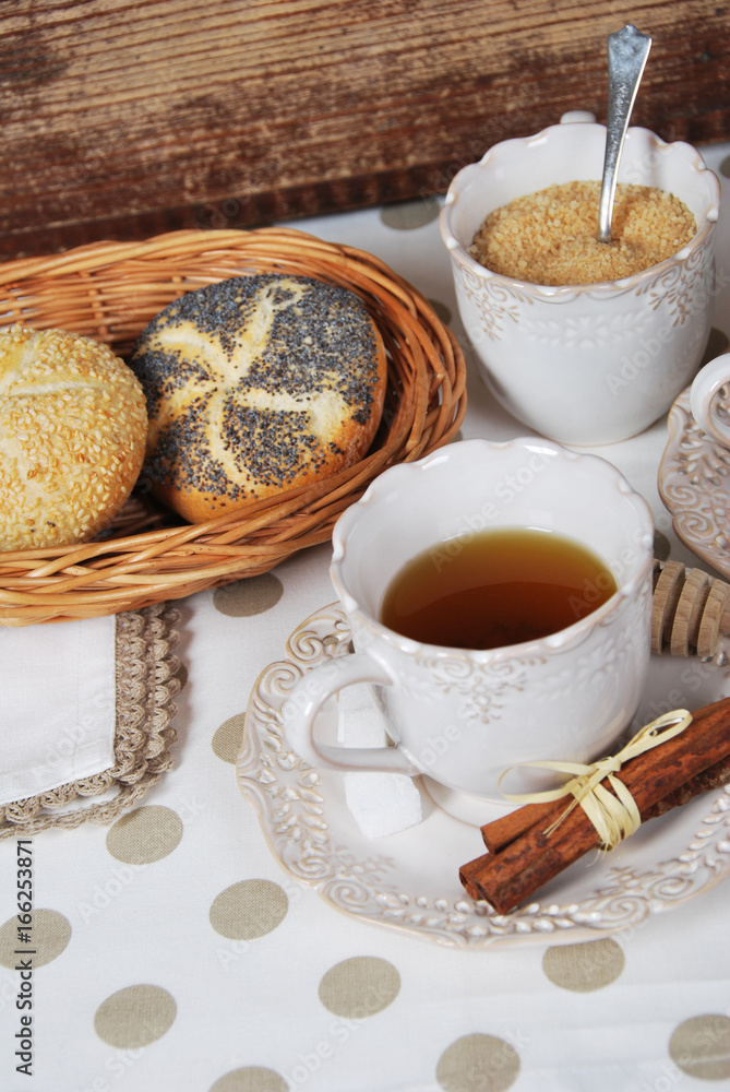 Tasty fresh buns with granny's tea in a retro cup Tasty fresh buns with granny's tea in a retro cup