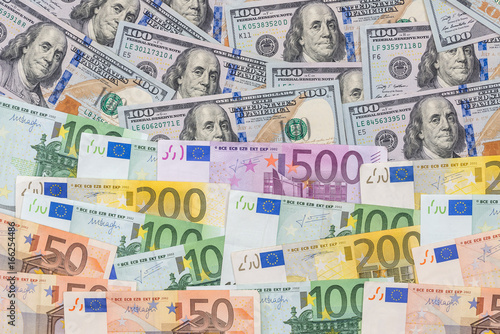 mix dollar and euro bills. background. money.