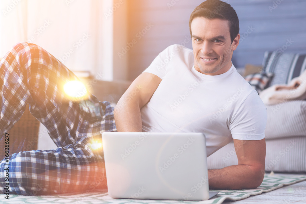 Smiling male person working with computer Smiling male person working with computer