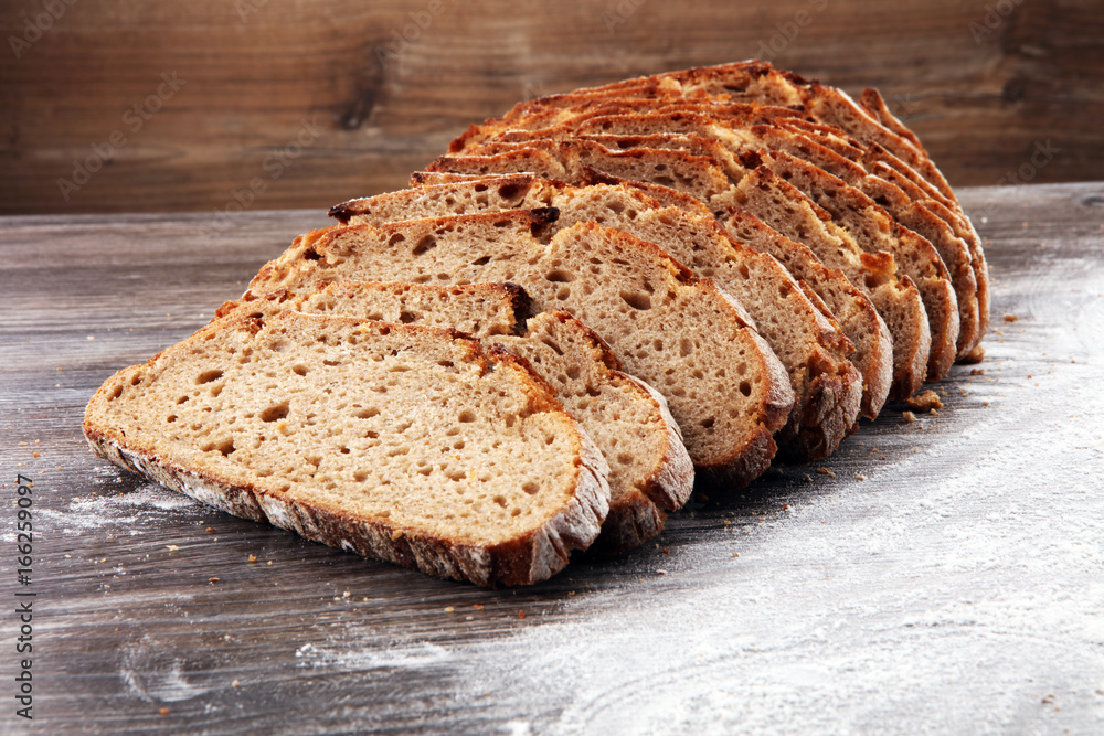 freshly baked bread on wooden board. cutted bread freshly baked bread on wooden board. cutted bread