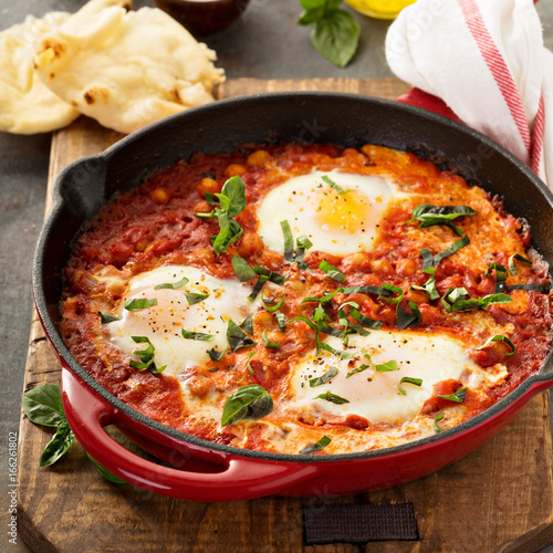 Shakshuka with chickpeas in a skillet