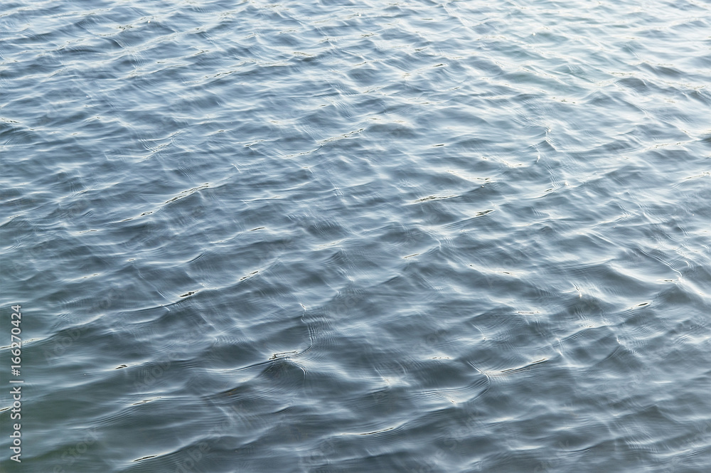 Fototapeta premium Blue river water background texture close up