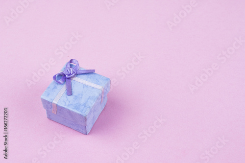 Gift box on a pink background © Aminah