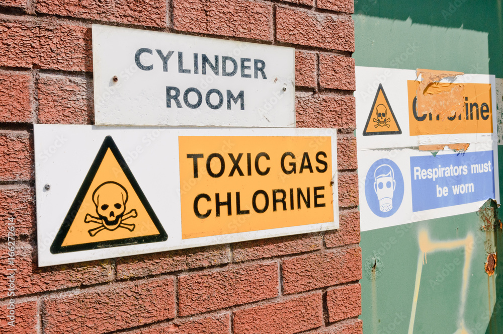 Signs warning of the presence of Chlorine gas at a water treatment plant Signs warning of the presence of Chlorine gas at a water treatment plant