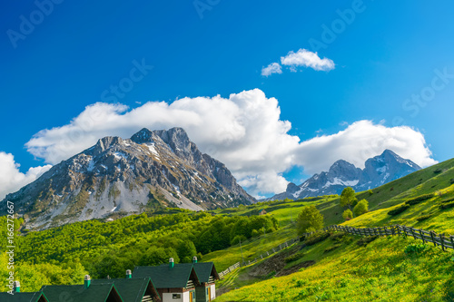 Small houses at the foot of the mountain for a holiday in Montenegro. Komovi.