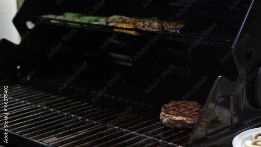 Chef Preparing Meat on the Grill Chef Preparing Meat on the Grill