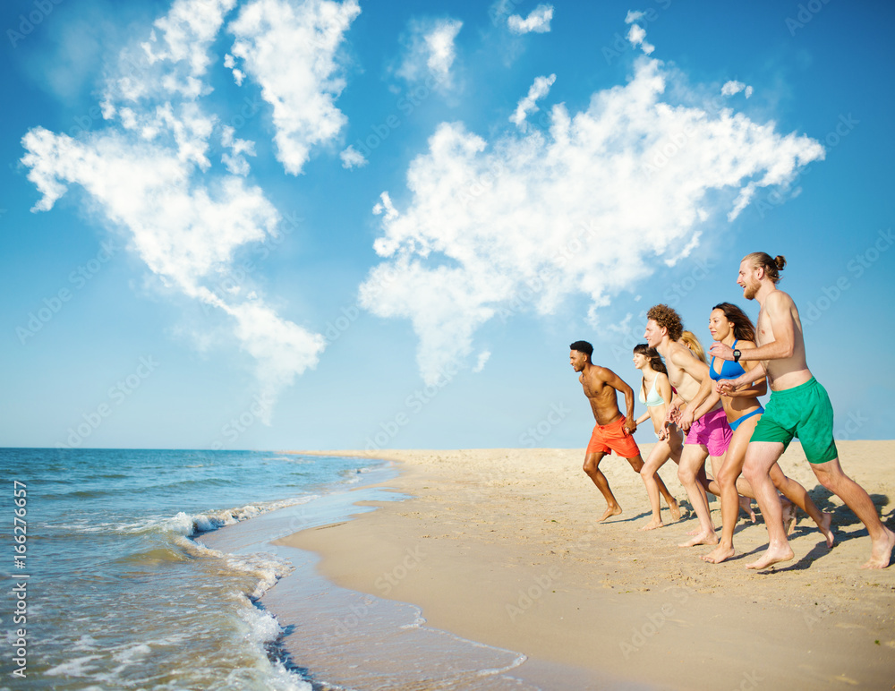 Group of friends run in the sea with world map made of clouds. Concept of summertime