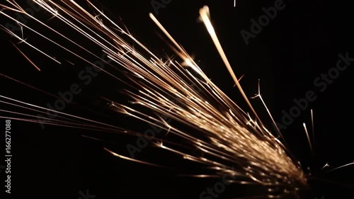 Sparks fly out of the darkness. Screensaver or element for special effects. Black color instead of green background.