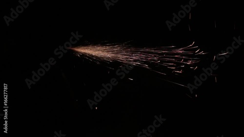 Sparks fly out of the darkness. Screensaver or element for special effects. Black color instead of green background.