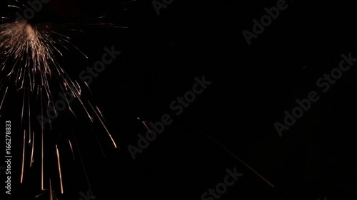 Sparks fly out of the darkness. Screensaver or element for special effects. Black color instead of green background.