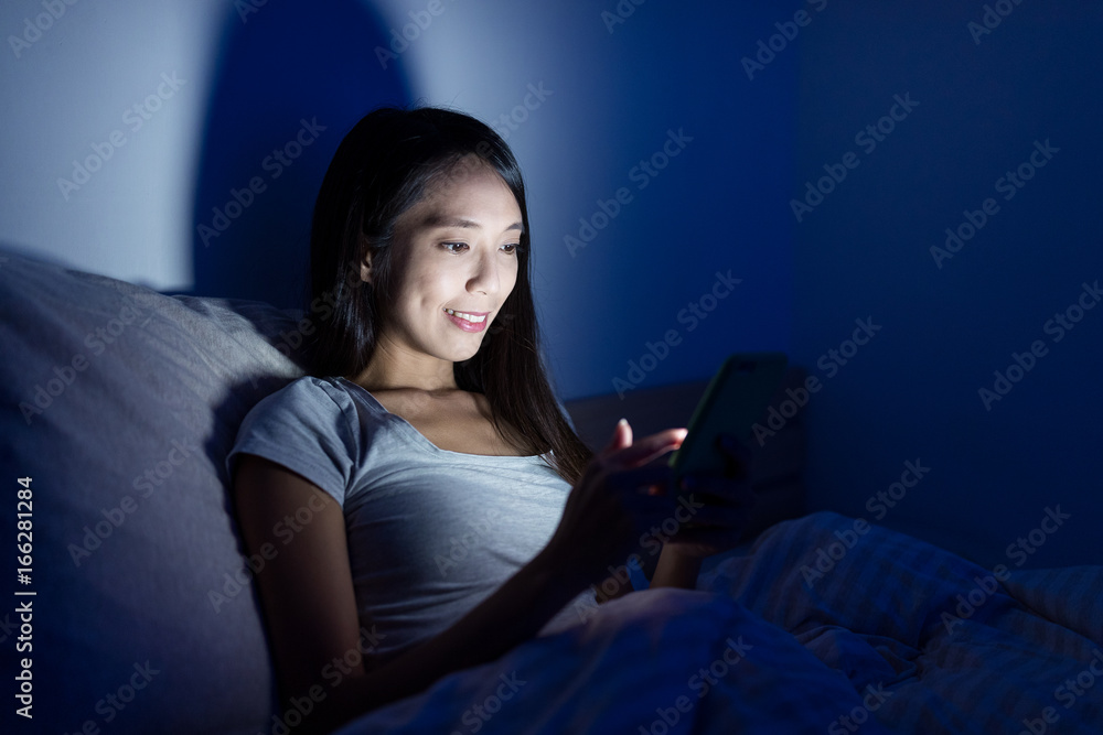 Woman working mobile phone at night Woman working mobile phone at night