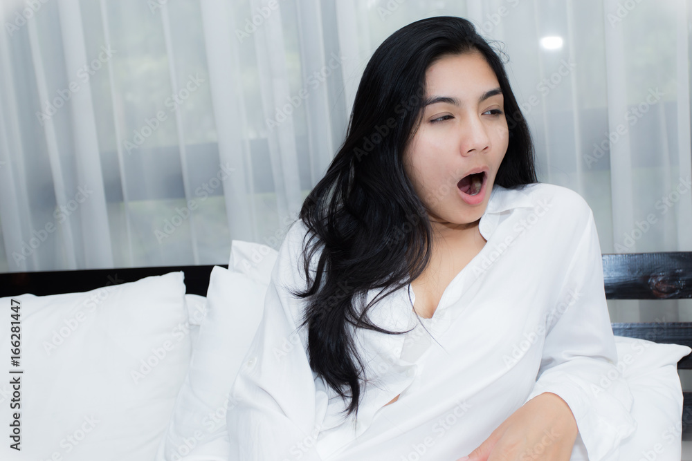 Beautiful woman waking up in her bed Beautiful woman waking up in her bed