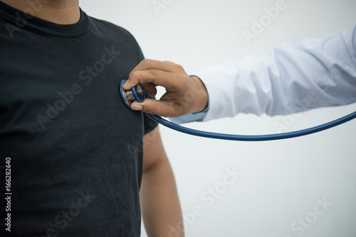 Close-up of doctor checking patient's pulse.