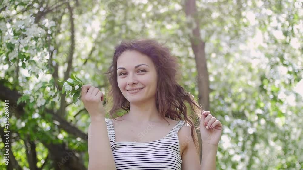 young woman enjoying in the background of the tree young woman enjoying in the background of the tree
