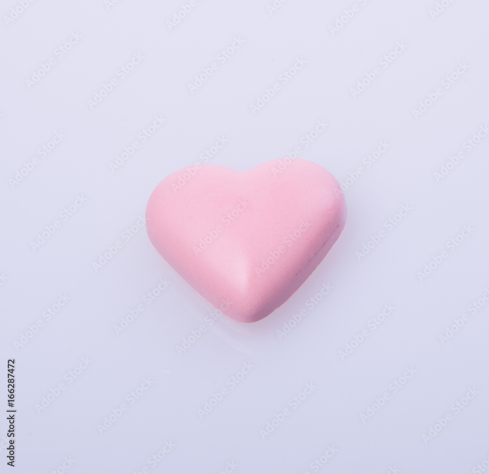 chocolate in pink colour or love shape chocolate.