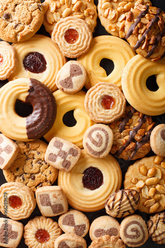 Background of cookies assorted close-up. Vertical top view
