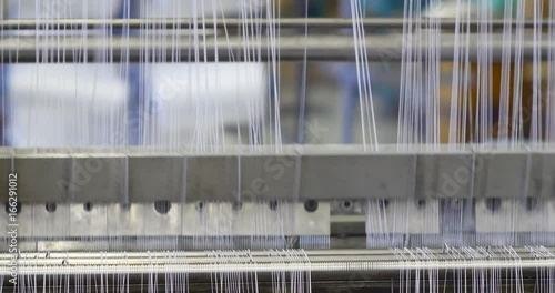 Industrial knitting machine producing cotton yarn