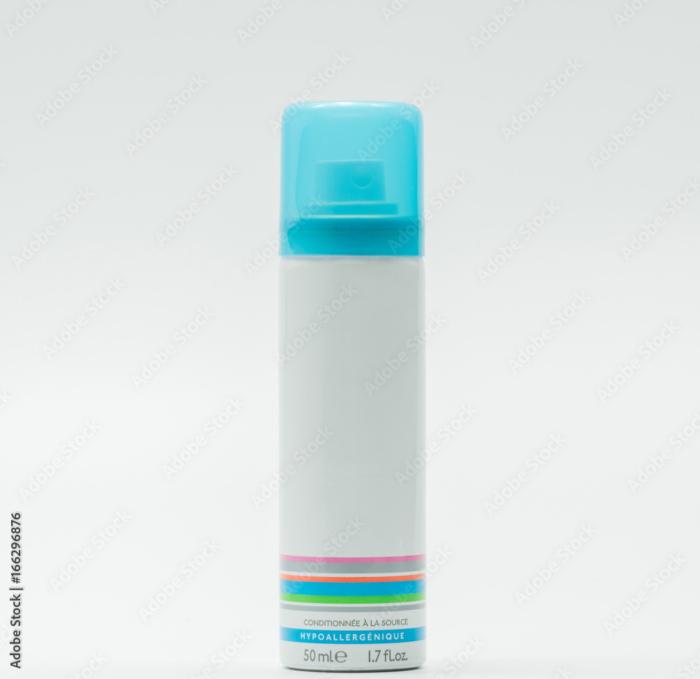 Facial spray bottle and blue cap with blank label isolated on white background, just add your own text Facial spray bottle and blue cap with blank label isolated on white background, just add your own text