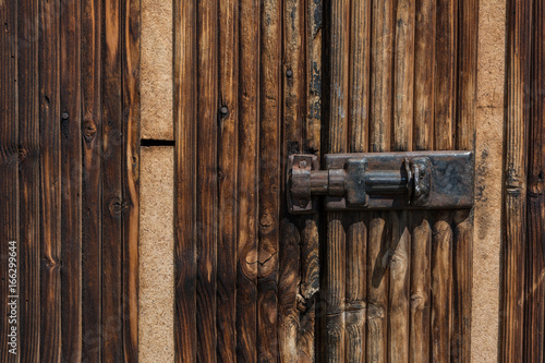 Vintage lock on old wooden door