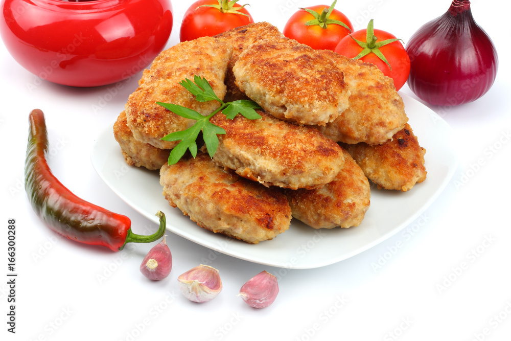 Homemade cutlets with tomato in white plate isolated on white background. Homemade cutlets with tomato in white plate isolated on white background.