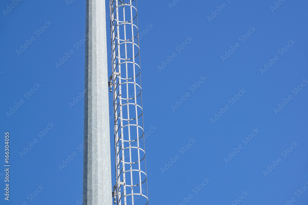 stairs to the comunications pole with wires and cable stairs to the comunications pole with wires and cable