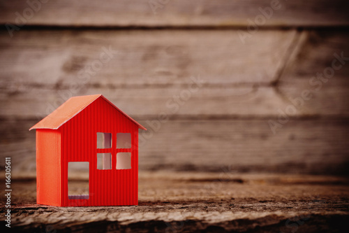 paper house on wooden background